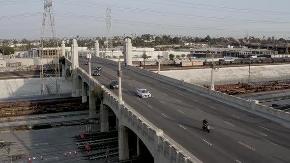 Urban City Concept - Cars Driving on Bridge Overpass in Los Angeles. Static Aerial Drone Establishin alt