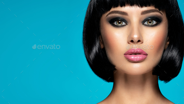 Glamour fashion model with black gloss make-up.