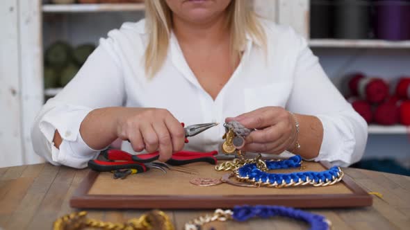 Closeup of Craftswoman Working and Making Handmade Jewelery in Workshop