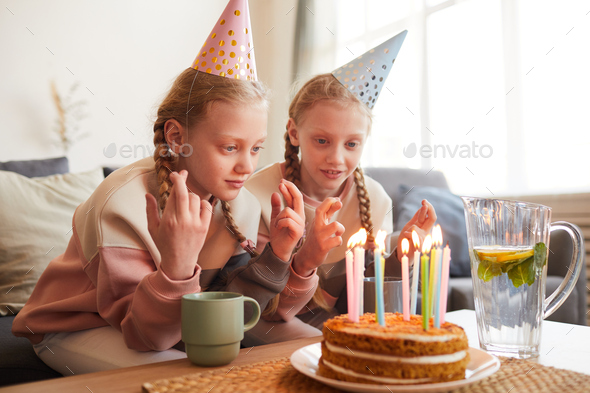 Girls sitting at birthday party