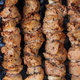 Appetizing meat on skewers. Barbecue camping dinner. - PhotoDune Item for Sale