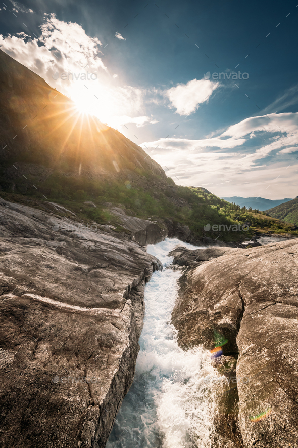 Kinsarvik, Hordaland, Norway. Water Stream Through Rocks In Hardangervidda Mountain Plateau. Sun - Stock Photo - Images