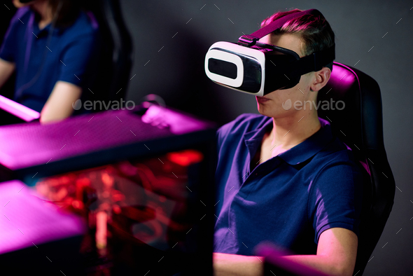 Gamer in virtual reality headset