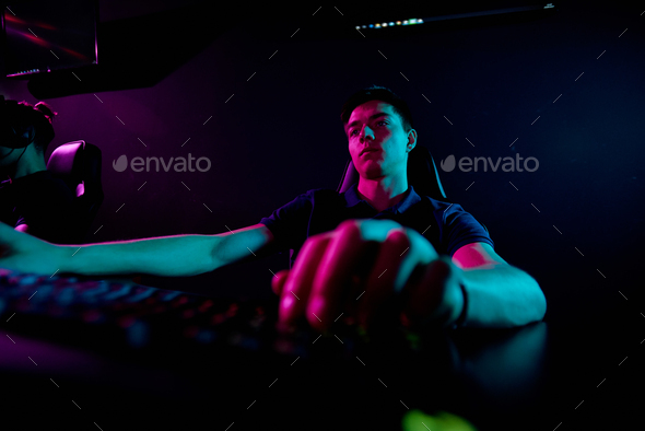 Boring man playing video game
