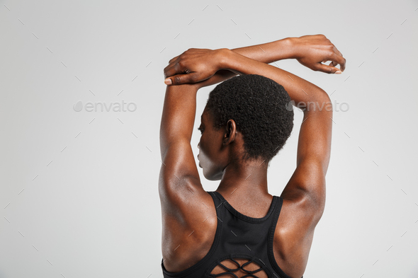 African American Woman Stretching Her Arms Overhead Isolated High