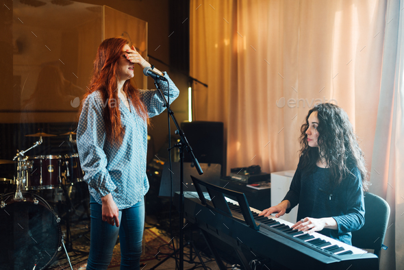 girl does exercises with covering her face for deprivation of feelings in a vocal lesson - Stock Photo - Images