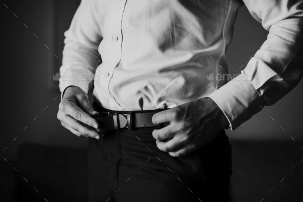 man wearing belt in trousers