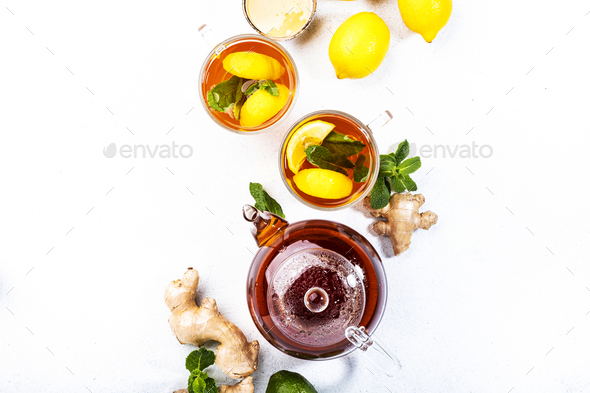 Healing black herbal tea with ginger, honey, lemon and mint