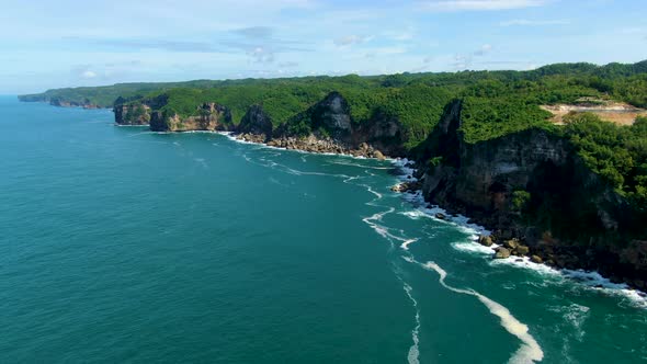 Picturesque coastal cliffs on tropical Java Island, Indonesia, aerial view alt