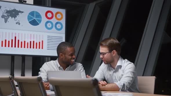 Smiling business people working with computer technology alt