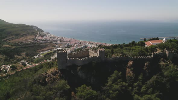Castle of the Moors, walled medieval fort on an hill of Sesimbra, Portugal alt