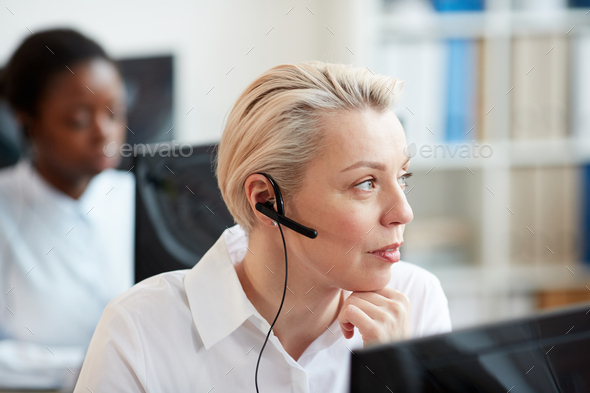 Blonde Female Operator Working with Customer