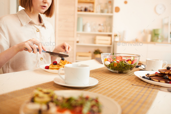 Woman Enjoying Delicious Desserts in Cozy Kitchen