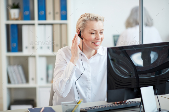 Smiling Customer Relations Manager Wearing Headset