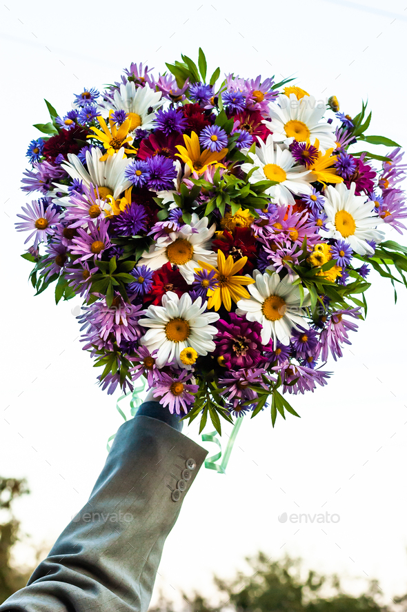 Bouquet from a camomile and other flowers