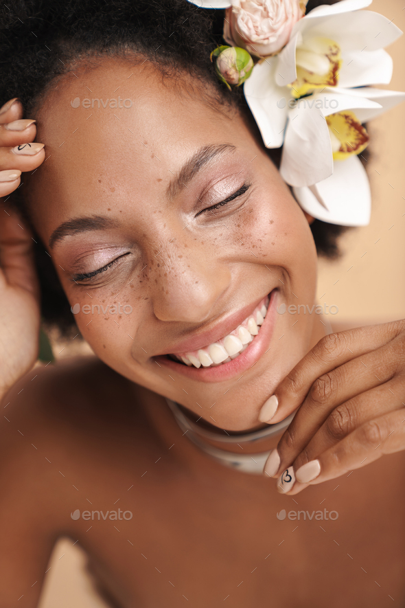 Portrait Of Half Naked African American Woman With Flowers In Her Hair Stock Photo By Vadymvdrobot