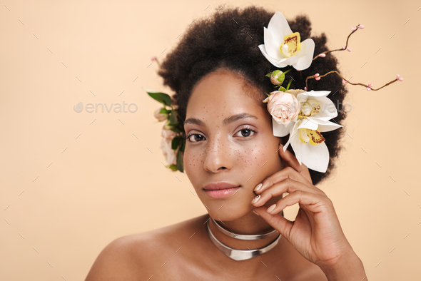 Portrait Of Half Naked African American Woman With Flowers In Her Hair Stock Photo By Vadymvdrobot