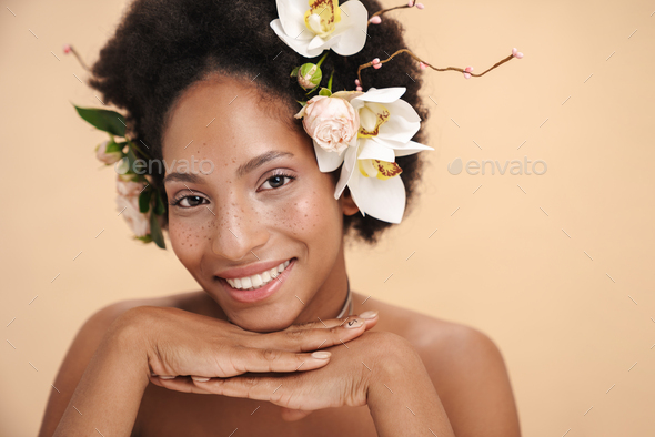 Portrait Of Half Naked African American Woman With Flowers In Her Hair