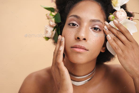 Portrait Of Half Naked African American Woman With Flowers In Her Hair Stock Photo By Vadymvdrobot