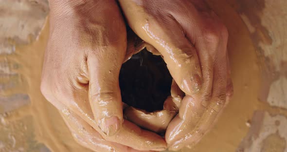 Hands Working On Pottery Wheel alt