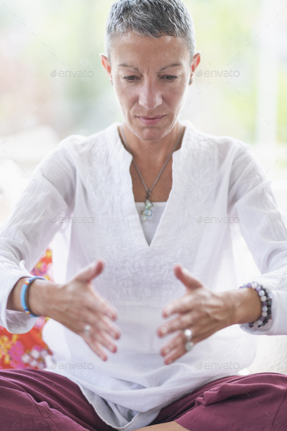 Improving Mental Focus Meditation Hand Gesture Stock Photo by microgen