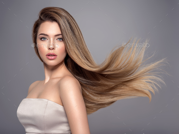 Beautiful woman with long straight hair. Blonde girl. Stock Photo by  valuavitaly