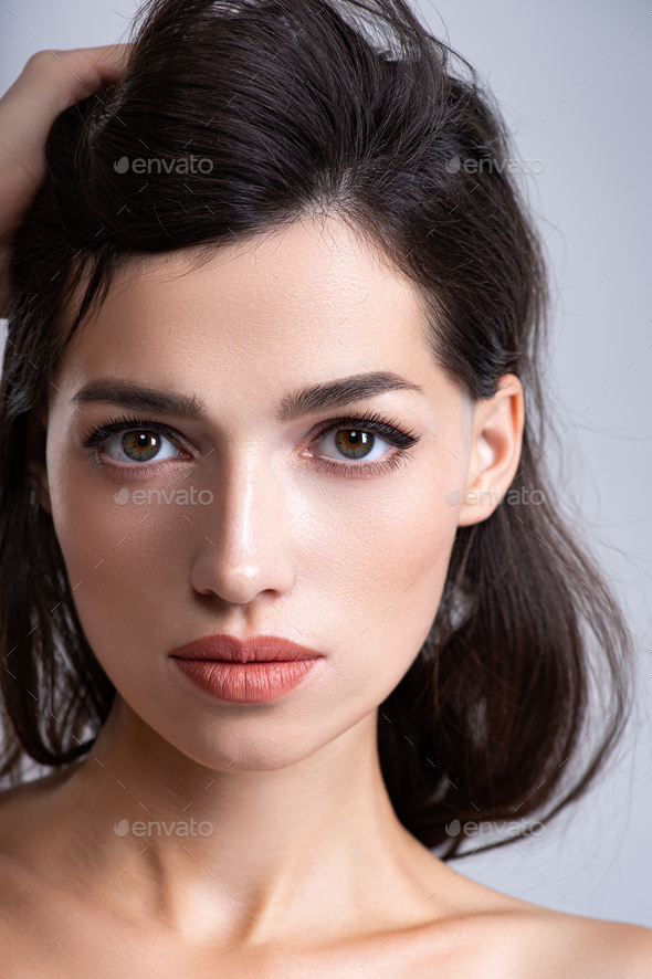 Portrait of brunette woman with beautiful hairstyle. - Stock Photo - Images