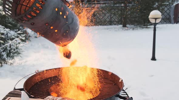Redhot Charcoal Is Poured Into Brazier or Grill for Further Preparation of Great Steak alt