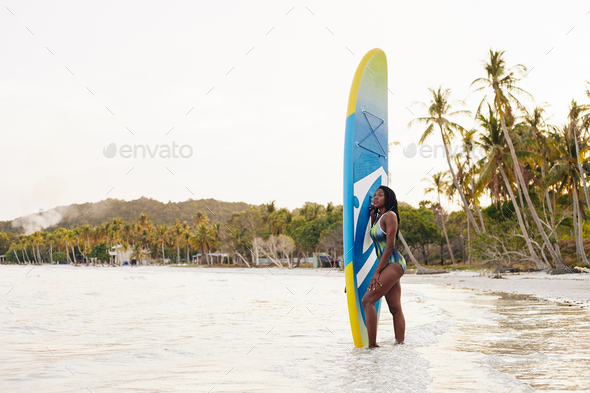 Woman with sup surfing board