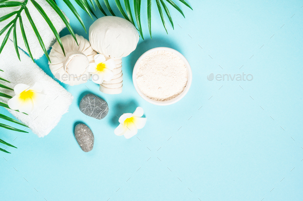 Spa herbal compressing balls on blue background Stock Photo by Nadianb