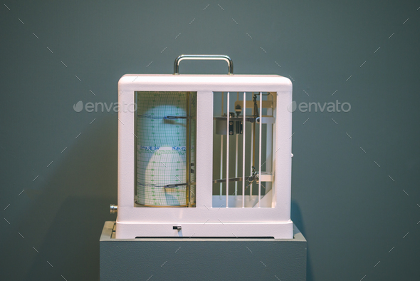 Seismological device for measuring earthquakes. Seismograph records an earthquake on the sheet of - Stock Photo - Images