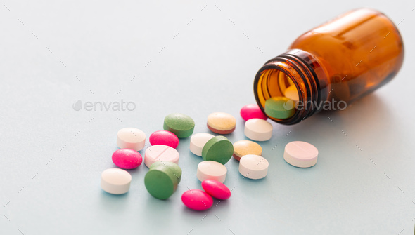 Medicine pills on blue background. Health pharmacy concept Stock Photo by  rawf8