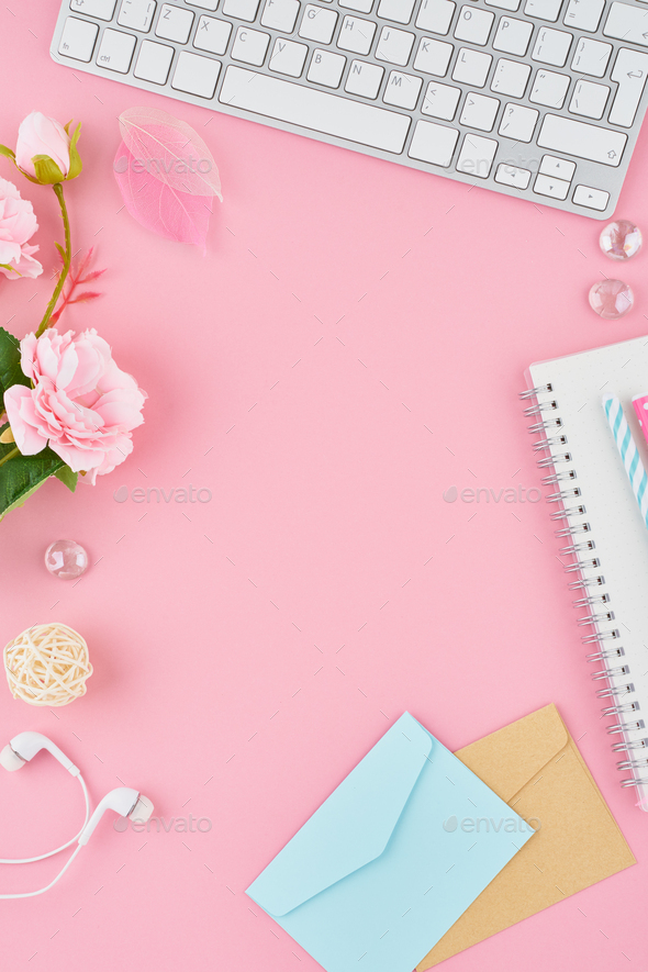 Blank notepad page in bullet journal on bright pink office desktop