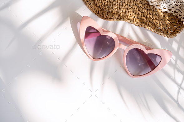 Travel accessories on the table with shadow of plam leave, Summer vacation concept