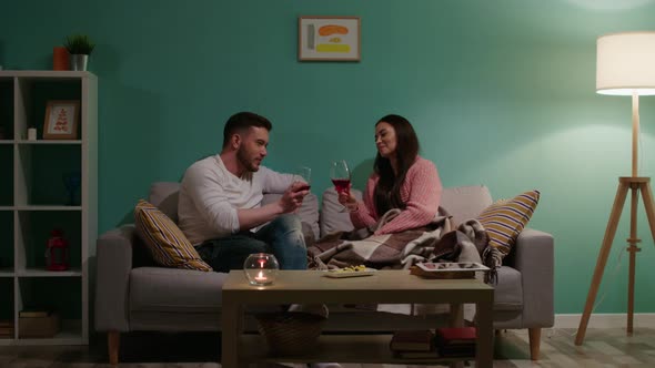 Woman and Man Are Relaxing and Drinking Wine