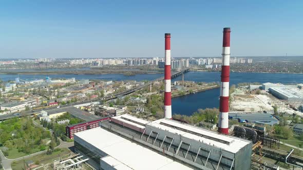 Aerial Drone View of Large Red and White Chimney Without Smoke at Sunny Day