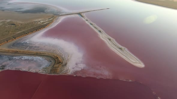 Aerial Shot of a Wrigling Sand Shore in Dark Pink Waters in the Black Sea in Summer