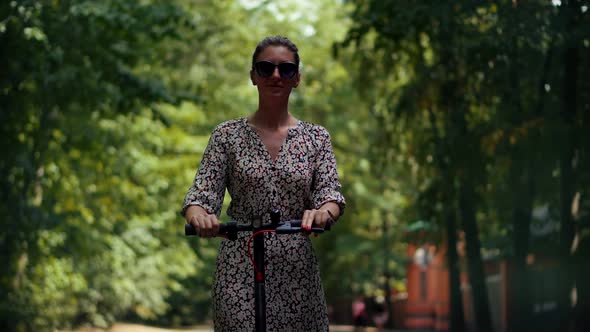 Fun Driving Electric Scooter. Relax On Kick Scooter. Sharing Ecology Transport. City Transport. alt