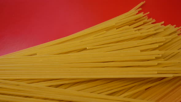 Long Pasta on Red Background