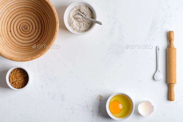 Homemade production of fresh healthy bread of other pastry from natural ingredients on a light grey - Stock Photo - Images