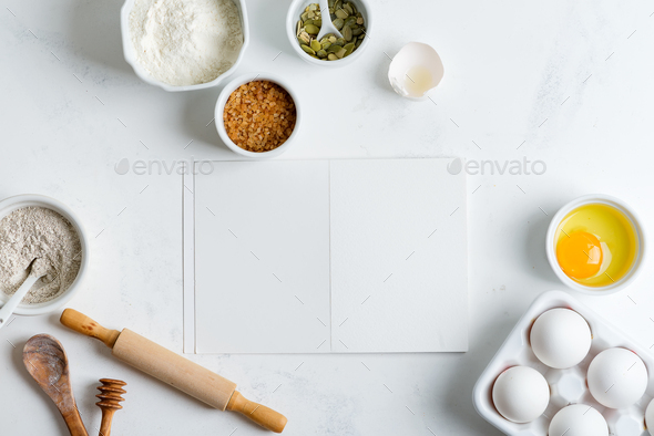 Baking ingredients for cooking homemade traditional bread with paper for recipe on a light grey - Stock Photo - Images