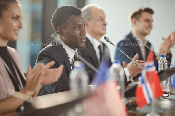 African man clapping at conference