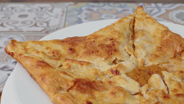 Close Up of Georgian Pie Spinning Round on Plate