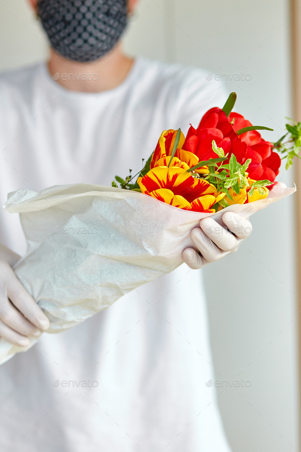 Courier Delivery Man In Medical Latex Gloves And Mask Safely