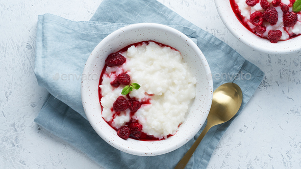 Rice Pudding. Long banner, Vegan Coconut diet breakfast with coconut milk, raspberry