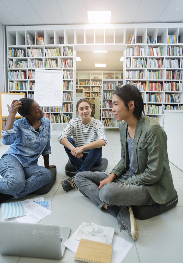 People preparing the project in the library - Stock Photo - Images