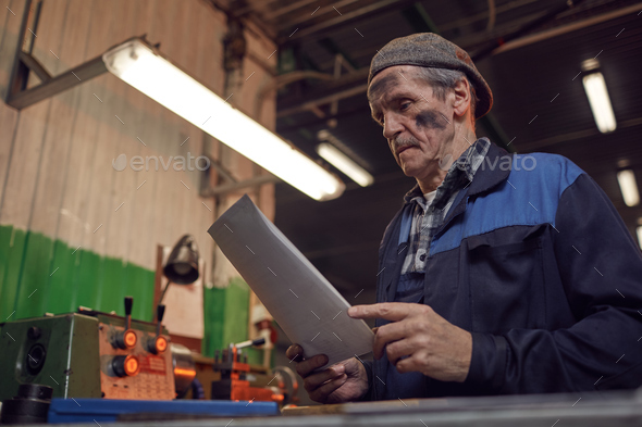 Manual worker reading the contract