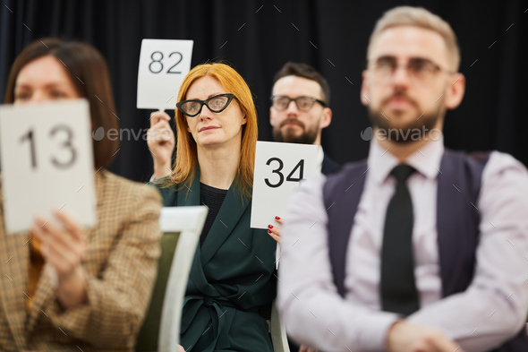 Group of people at auction - Stock Photo - Images