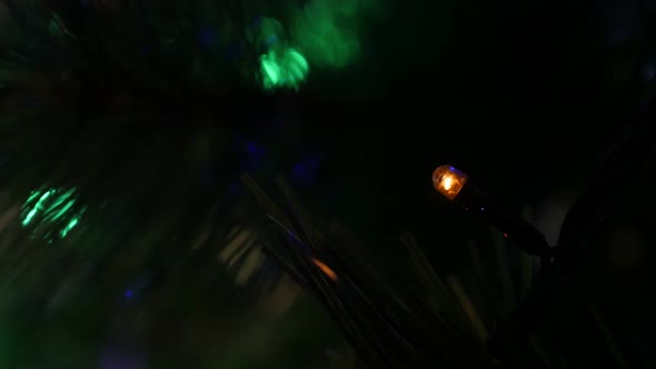 LED lights blinking at night shallow DOF 4K 2160p 30fps UltraHD footage - Christmas tree decorative  alt