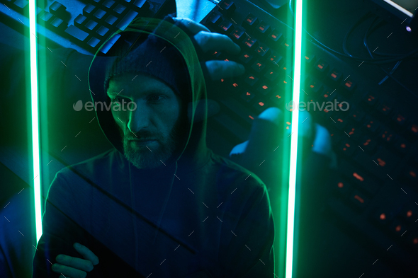 Computer hacker typing a password - Stock Photo - Images